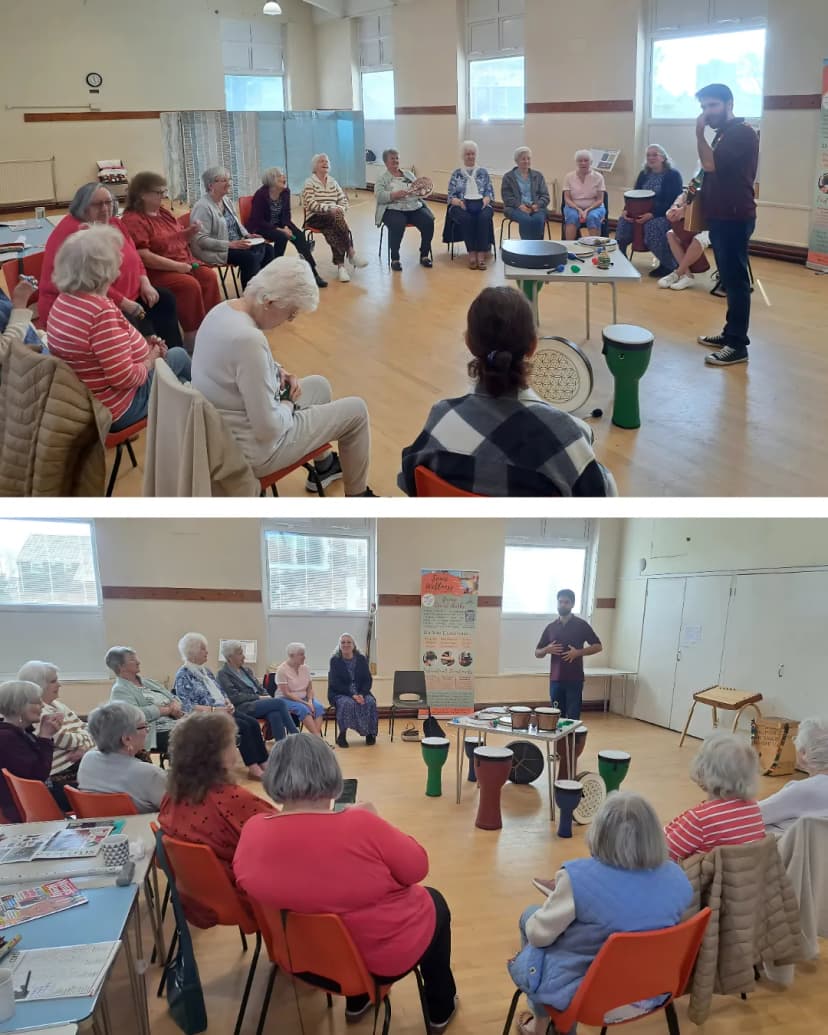 Community drum circle session with participants seated in a circle